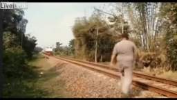 CRAZY MAN RUNS IN FRONT OF TRAIN!!! MUST SEE!!!