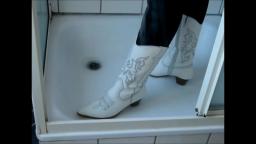 Jana fill and messy her white heel cowgirl boots in shower trailer