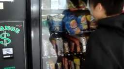 Kid Breaks Vending Machine