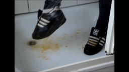 Jana crushes a pumpkin with her shiny black Adidas Superstars and washes them in the shower trailer