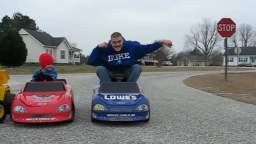 Grown Man Races Kids on Power Wheels