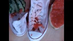 Jana crushes a watermelon with her white Converse Chucks and messy them with it close up trailer